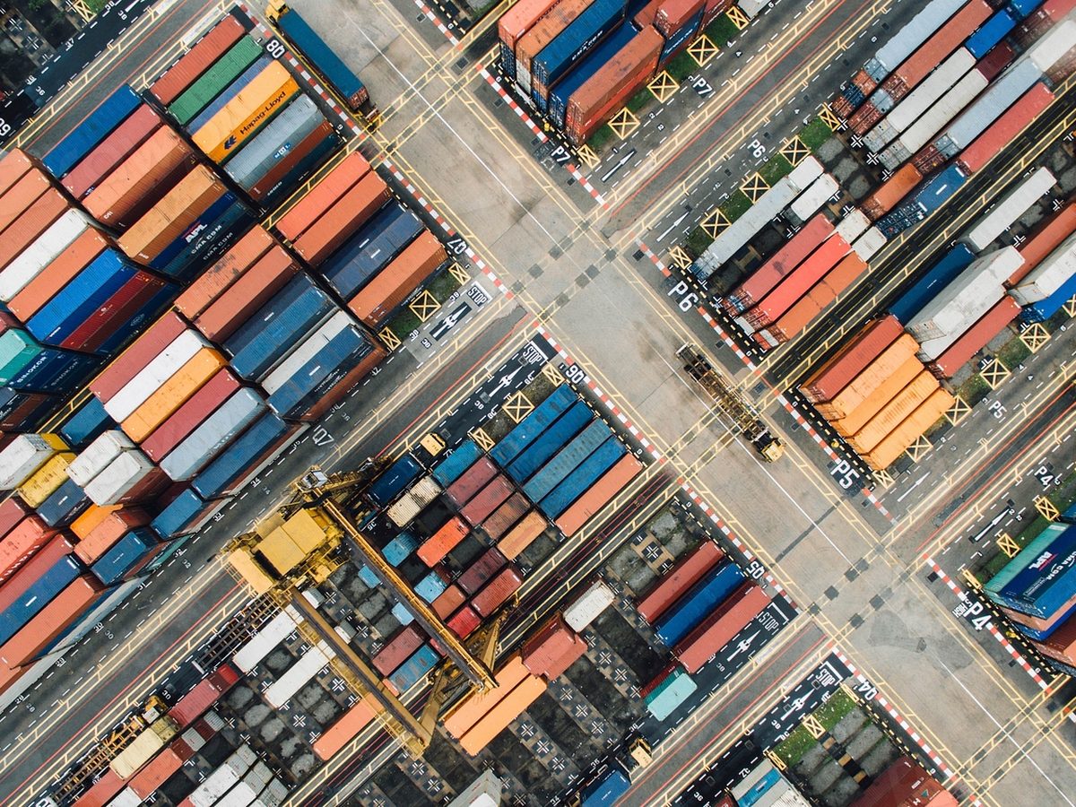 Aerial view of a container yard with gantry cranes